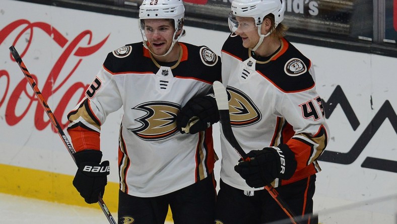 Feb 2, 2021; Los Angeles, California, USA; Anaheim Ducks center Danton Heinen (43) celebrates with center Sam Steel (23) his goal scored against the Los Angeles Kings during the first period at Staples Center. Steel provided an assist on the goal. Mandatory Credit: Gary A. Vasquez-USA TODAY Sports