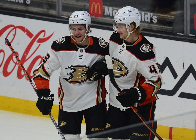 Feb 2, 2021; Los Angeles, California, USA; Anaheim Ducks center Danton Heinen (43) celebrates with center Sam Steel (23) his goal scored against the Los Angeles Kings during the first period at Staples Center. Steel provided an assist on the goal. Mandatory Credit: Gary A. Vasquez-USA TODAY Sports