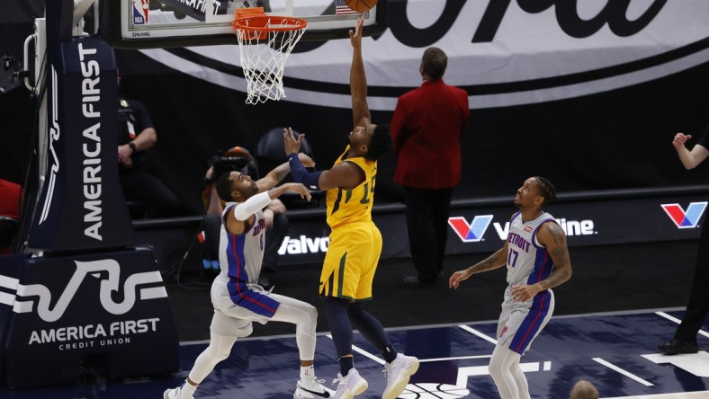 Feb 2, 2021; Salt Lake City, Utah, USA; Utah Jazz guard Donovan Mitchell (45) shoots against Detroit Pistons guard Wayne Ellington (8) in the first quarter at Vivint Smart Home Arena. Mandatory Credit: Jeffrey Swinger-USA TODAY Sports