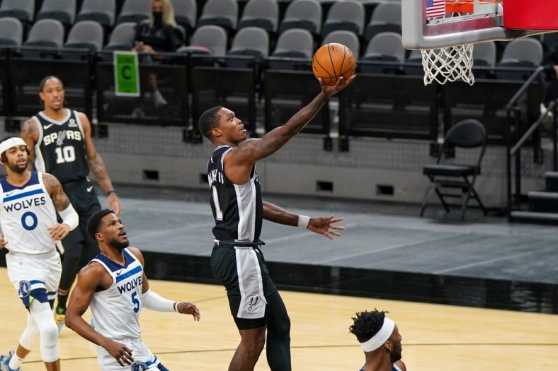 Feb 3, 2021; San Antonio, Texas, USA; San Antonio Spurs guard Lonnie Walker IV (1) lays the ball in during the first half against the Minnesota Timberwolves at the AT&T Center. Mandatory Credit: Daniel Dunn-USA TODAY Sports