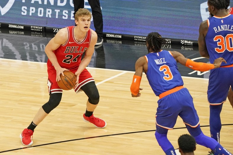 Feb 3, 2021; Chicago, Illinois, USA;  Chicago Bulls forward Lauri Markkanen (24) dribbles the ball against New York Knicks center Nerlens Noel (3) during the first quarter at the United Center. Mandatory Credit: Mike Dinovo-USA TODAY Sports