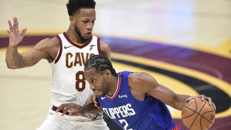 Feb 3, 2021; Cleveland, Ohio, USA; LA Clippers forward Kawhi Leonard (2) drives to the basket against Cleveland Cavaliers forward Lamar Stevens (8) in the second quarter at Rocket Mortgage FieldHouse. Mandatory Credit: David Richard-USA TODAY Sports