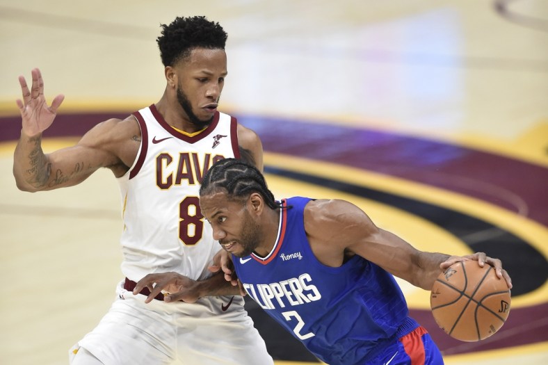 Feb 3, 2021; Cleveland, Ohio, USA; LA Clippers forward Kawhi Leonard (2) drives to the basket against Cleveland Cavaliers forward Lamar Stevens (8) in the second quarter at Rocket Mortgage FieldHouse. Mandatory Credit: David Richard-USA TODAY Sports