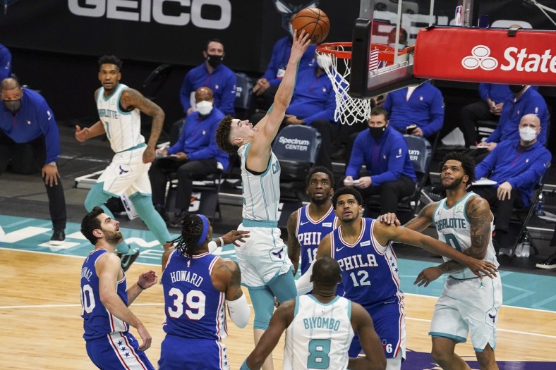Feb 3, 2021; Charlotte, North Carolina, USA; Charlotte Hornets guard LaMelo Ball (2) goes up for a dunk against the Philadelphia 76ers during the second half at Spectrum Center. Mandatory Credit: Jim Dedmon-USA TODAY Sports