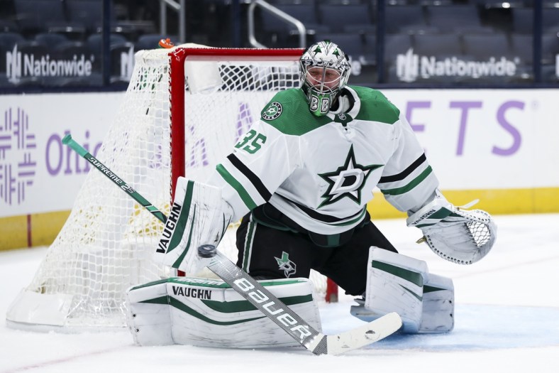 Feb 4, 2021; Columbus, Ohio, USA; Dallas Stars goaltender Anton Khudobin (35) makes a blocker save in net against the Columbus Blue Jackets in the first period at Nationwide Arena. Mandatory Credit: Aaron Doster-USA TODAY Sports