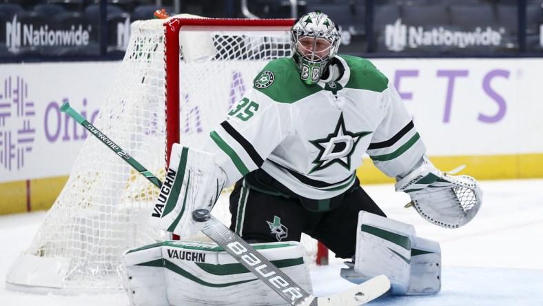 Feb 4, 2021; Columbus, Ohio, USA; Dallas Stars goaltender Anton Khudobin (35) makes a blocker save in net against the Columbus Blue Jackets in the first period at Nationwide Arena. Mandatory Credit: Aaron Doster-USA TODAY Sports