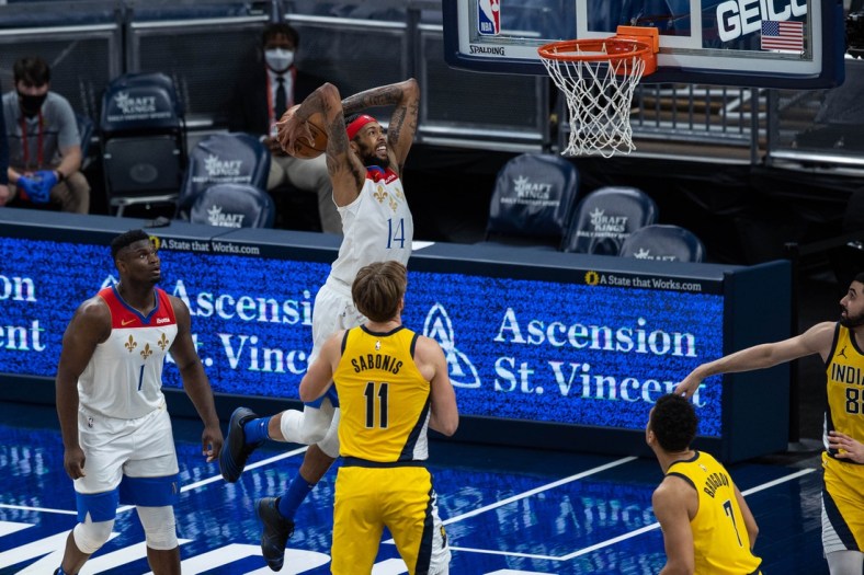 Feb 5, 2021; Indianapolis, Indiana, USA; New Orleans Pelicans forward Brandon Ingram (14) slam dunks the ball  in the second quarter against the Indiana Pacers at Bankers Life Fieldhouse. Mandatory Credit: Trevor Ruszkowski-USA TODAY Sports