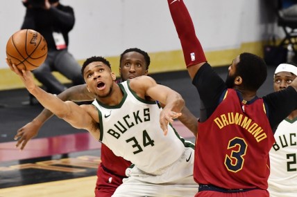 Feb 5, 2021; Cleveland, Ohio, USA; Milwaukee Bucks forward Giannis Antetokounmpo (34) drives to the basket against Cleveland Cavaliers center Andre Drummond (3) during the fourth quarter at Rocket Mortgage FieldHouse. Mandatory Credit: Ken Blaze-USA TODAY Sports