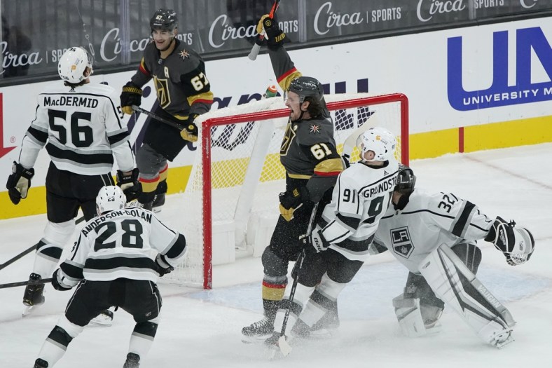 Feb 5, 2021; Las Vegas, Nevada, USA; Vegas Golden Knights right wing Mark Stone (61) celebrates after scoring against Los Angeles Kings goaltender Jonathan Quick (32) during the first period of an NHL hockey game Friday, Feb. 5, 2021, in Las Vegas at T-Mobile Arena. Mandatory Credit: John Locher/Pool Photo-USA TODAY Sports