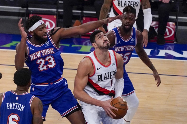 Feb 6, 2021; New York, New York, USA;   New York Knicks center Mitchell Robinson (23) guards Portland Trail Blazers center Enes Kanter (11) during the first half of an NBA basketball game, Saturday, Feb. 6, 2021, in New York.  Mandatory Credit:  Mary Altaffer/Pool Photo-USA TODAY Sports