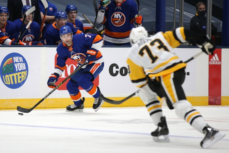 Feb 6, 2021; Uniondale, New York, USA; New York Islanders right wing Jordan Eberle (7) controls the puck against Pittsburgh Penguins defenseman Pierre-Olivier Joseph (73) during the second period at Nassau Veterans Memorial Coliseum. Mandatory Credit: Brad Penner-USA TODAY Sports