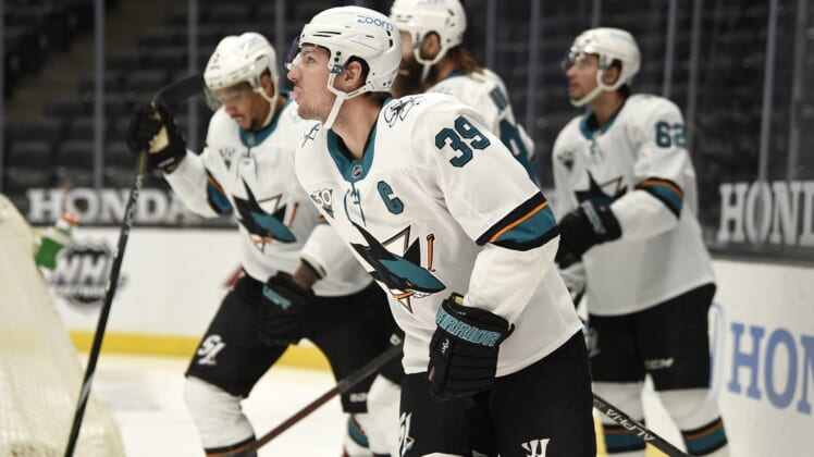 Feb 6, 2021; Anaheim, California, USA; San Jose Sharks center Logan Couture (39) skates back to the bench after scoring a goal during the first period against the Anaheim Ducks at Honda Center. Mandatory Credit: Kelvin Kuo-USA TODAY Sports