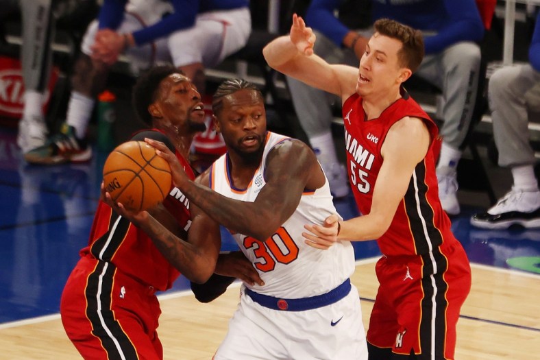 Feb 7, 2021; New York, New York, USA;   Duncan Robinson #55 and Bam Adebayo #13 of the Miami Heat defend against Julius Randle #30 of the New York Knicks at Madison Square Garden on February 07, 2021 in New York City. Mandatory Credit: Mike Stobe/Pool Photo-USA TODAY Sports