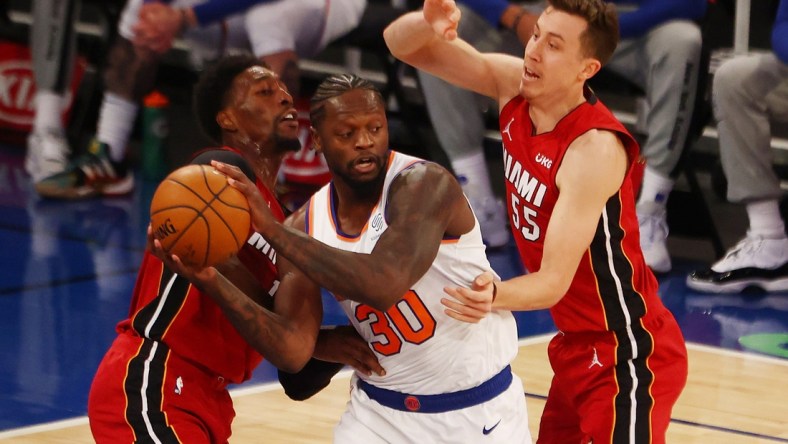 Feb 7, 2021; New York, New York, USA;   Duncan Robinson #55 and Bam Adebayo #13 of the Miami Heat defend against Julius Randle #30 of the New York Knicks at Madison Square Garden on February 07, 2021 in New York City. Mandatory Credit: Mike Stobe/Pool Photo-USA TODAY Sports