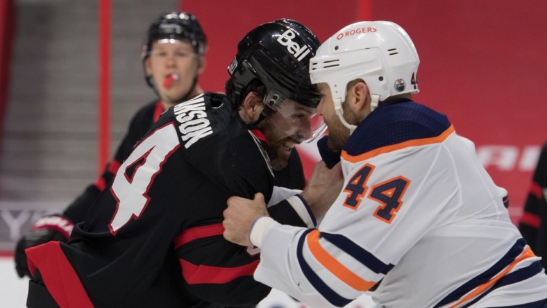 Feb 8, 2021; Ottawa, Ontario, CAN; Ottawa Senators defensman Erik Gudbranson (44) fights with Edmonton Oilers right wing Zack Kassian (44) in the first period at the Canadian Tire Centre. Mandatory Credit: Marc DesRosiers-USA TODAY Sports