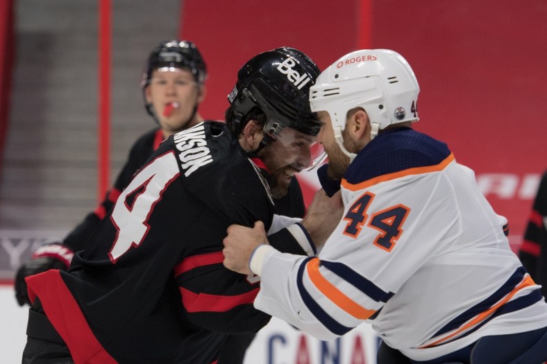 Feb 8, 2021; Ottawa, Ontario, CAN; Ottawa Senators defensman Erik Gudbranson (44) fights with Edmonton Oilers right wing Zack Kassian (44) in the first period at the Canadian Tire Centre. Mandatory Credit: Marc DesRosiers-USA TODAY Sports