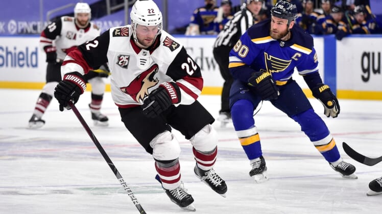 Feb 8, 2021; St. Louis, Missouri, USA;  Arizona Coyotes left wing Johan Larsson (22) handles the puck during the second period against the St. Louis Blues at Enterprise Center. Mandatory Credit: Jeff Curry-USA TODAY Sports