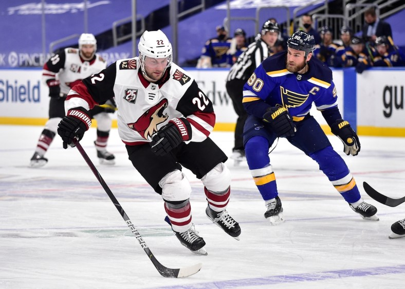 Feb 8, 2021; St. Louis, Missouri, USA;  Arizona Coyotes left wing Johan Larsson (22) handles the puck during the second period against the St. Louis Blues at Enterprise Center. Mandatory Credit: Jeff Curry-USA TODAY Sports