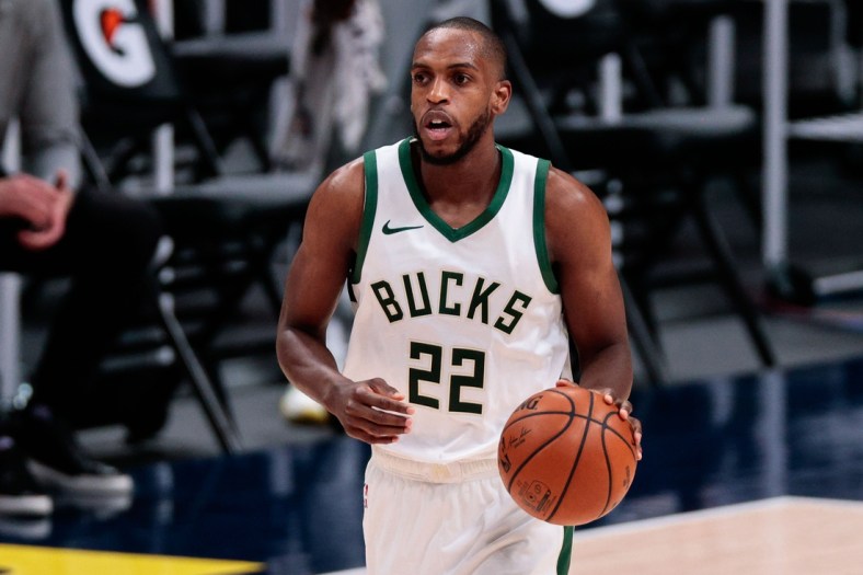 Feb 8, 2021; Denver, Colorado, USA; Milwaukee Bucks forward Khris Middleton (22) dribbles the ball up court in the second quarter against the Denver Nuggets at Ball Arena. Mandatory Credit: Isaiah J. Downing-USA TODAY Sports