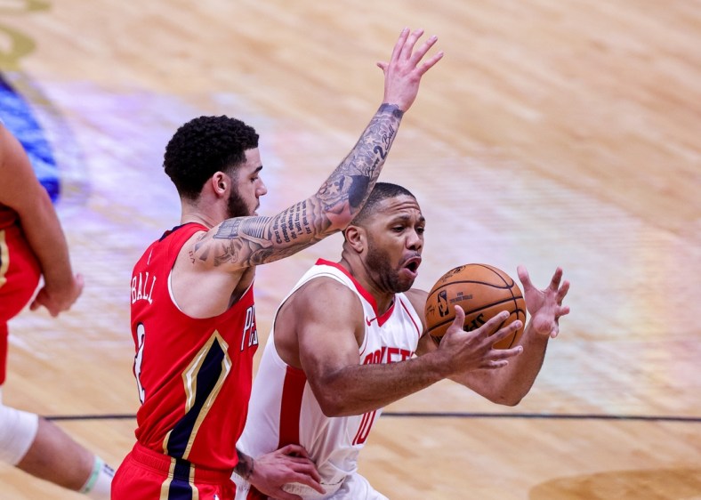 Feb 9, 2021; New Orleans, Louisiana, USA; Houston Rockets guard Eric Gordon (10) looses control of the ball as New Orleans Pelicans guard Lonzo Ball (2) defends during the first half at the Smoothie King Center. Mandatory Credit: Stephen Lew-USA TODAY Sports
