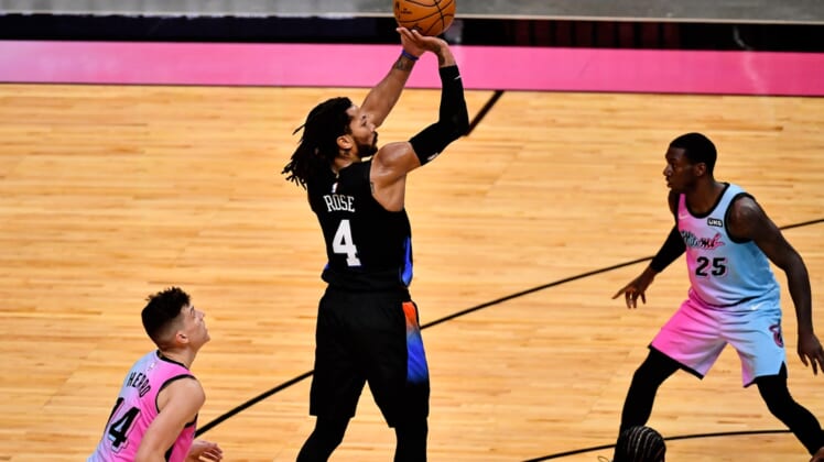 Feb 9, 2021; Miami, Florida, USA; New York Knicks guard Derrick Rose (4) attempts to shoot the ball against the Miami Heat during the first half at American Airlines Arena. Mandatory Credit: Jasen Vinlove-USA TODAY Sports