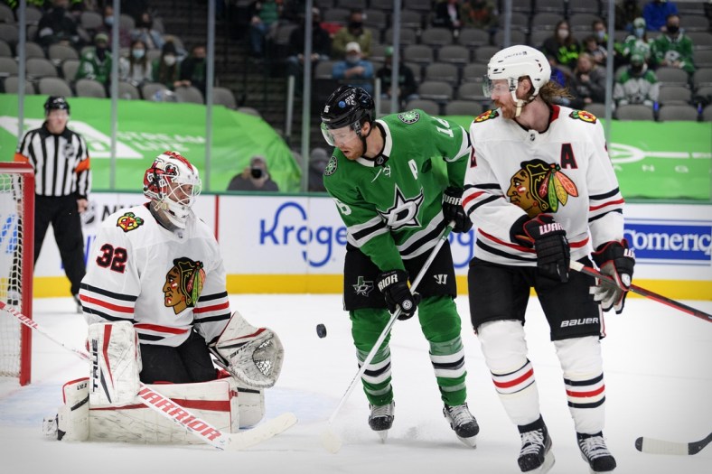 Feb 9, 2021; Dallas, Texas, USA; Chicago Blackhawks goaltender Kevin Lankinen (32) and defenseman Duncan Keith (2) defend against Dallas Stars center Joe Pavelski (16) during the second period at the American Airlines Center. Mandatory Credit: Jerome Miron-USA TODAY Sports
