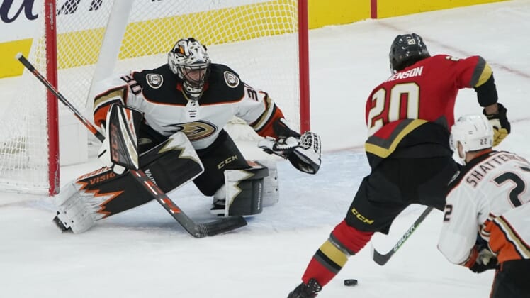 Feb 9, 2021; Las Vegas, Nevada, USA; Vegas Golden Knights center Chandler Stephenson (20) sets up a shot to score on Anaheim Ducks goaltender Ryan Miller (30) during the first period at T-Mobile Arena. Mandatory Credit: John Locher/Pool Photo-USA TODAY Sports