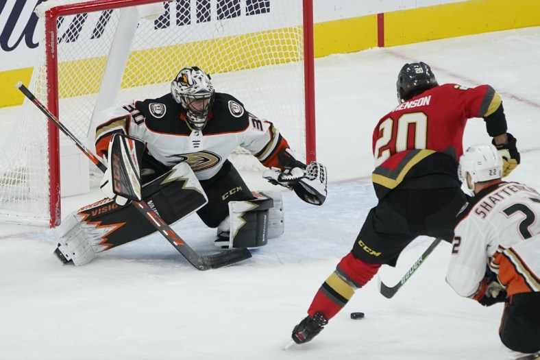 Feb 9, 2021; Las Vegas, Nevada, USA; Vegas Golden Knights center Chandler Stephenson (20) sets up a shot to score on Anaheim Ducks goaltender Ryan Miller (30) during the first period at T-Mobile Arena. Mandatory Credit: John Locher/Pool Photo-USA TODAY Sports