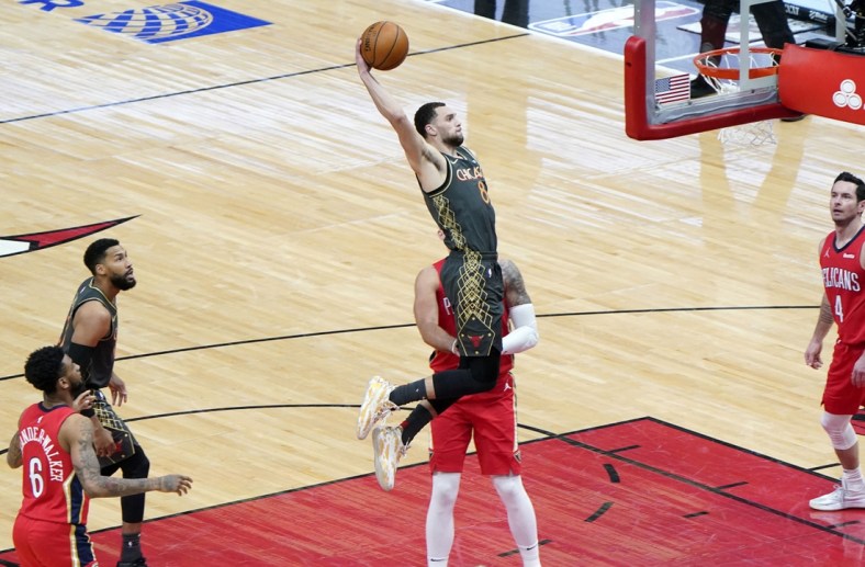 Feb 10, 2021; Chicago, Illinois, USA; Chicago Bulls guard Zach LaVine (8) dunk the ball against the New Orleans Pelicans during the second quarter at the United Center. Mandatory Credit: Mike Dinovo-USA TODAY Sports