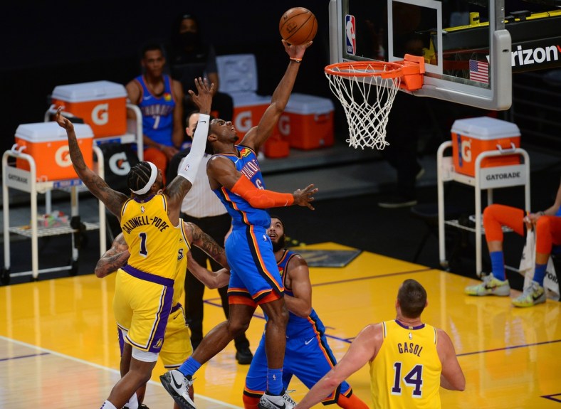Feb 10, 2021; Los Angeles, California, USA; Oklahoma City Thunder guard Hamidou Diallo (6) moves to the basket ahead of Los Angeles Lakers guard Kentavious Caldwell-Pope (1) during the first half at Staples Center. Mandatory Credit: Gary A. Vasquez-USA TODAY Sports