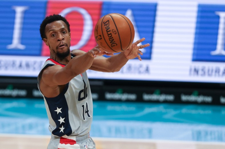 Feb 7, 2021; Charlotte, North Carolina, USA; Washington Wizards guard Ish Smith passes against the Charlotte Hornets in the first half at Spectrum Center. Mandatory Credit: Nell Redmond-USA TODAY Sports
