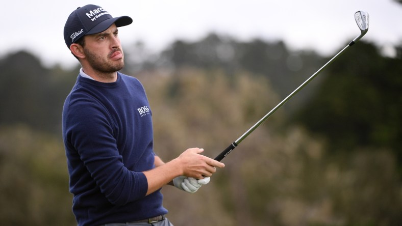 Feb 11, 2021; Pebble Beach, California, USA; Patrick Cantlay watches his shot from the 17th tee during the first round of the AT&T Pebble Beach Pro-Am golf tournament at Pebble Beach Golf Links. Mandatory Credit: Orlando Ramirez-USA TODAY Sports