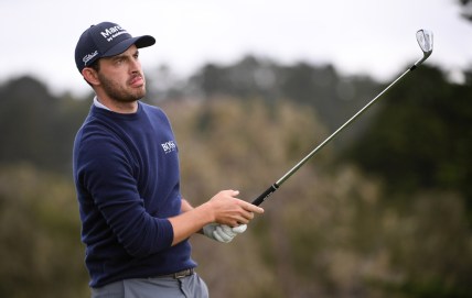 Feb 11, 2021; Pebble Beach, California, USA; Patrick Cantlay watches his shot from the 17th tee during the first round of the AT&T Pebble Beach Pro-Am golf tournament at Pebble Beach Golf Links. Mandatory Credit: Orlando Ramirez-USA TODAY Sports