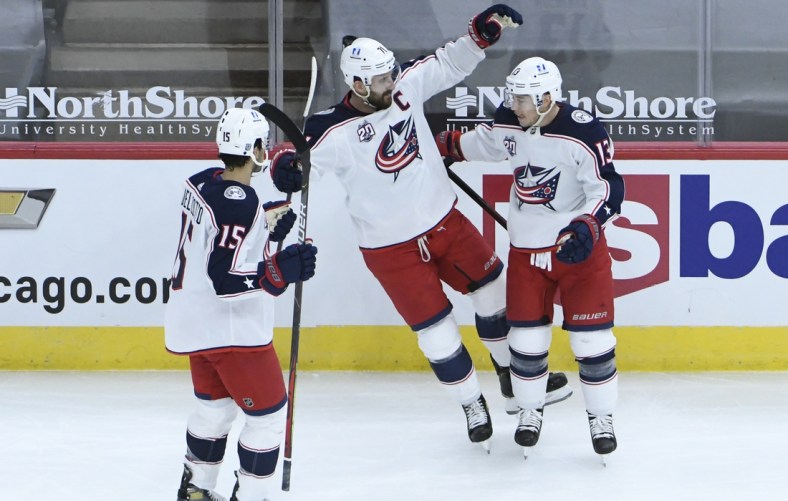 Feb 11, 2021; Chicago, Illinois, USA; Columbus Blue Jackets right wing Cam Atkinson (13) celebrates his goal against the Chicago Blackhawks with Jackets left wing Nick Foligno (71) during the first period at United Center. Mandatory Credit: David Banks-USA TODAY Sports