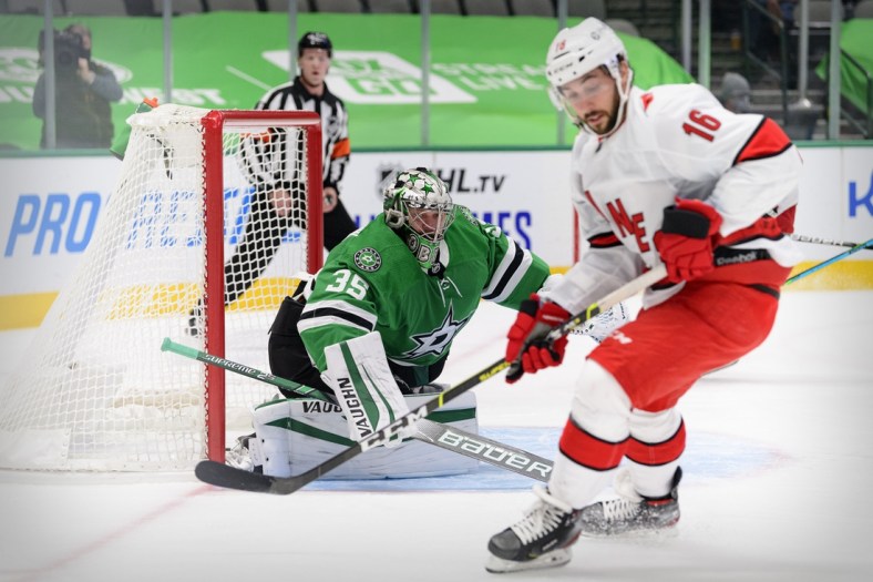 Feb 11, 2021; Dallas, Texas, USA; Dallas Stars goaltender Anton Khudobin (35) defends the goal against Carolina Hurricanes center Vincent Trocheck (16) during the first period at the American Airlines Center. Mandatory Credit: Jerome Miron-USA TODAY Sports