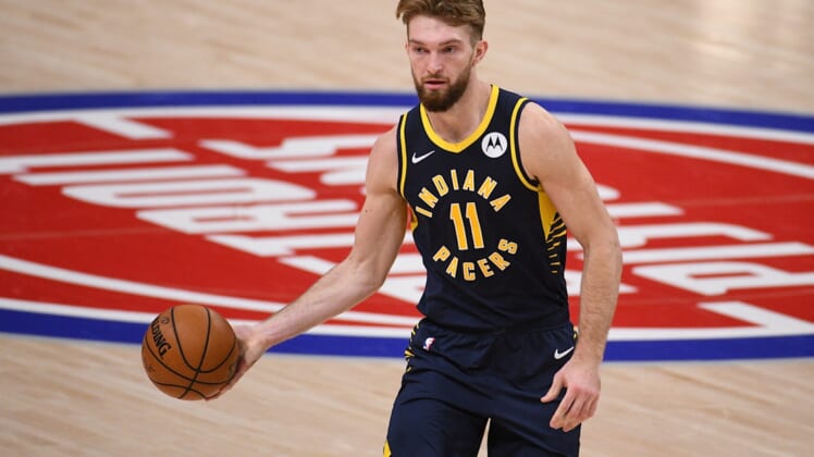 Feb 11, 2021; Detroit, Michigan, USA; Indiana Pacers forward Domantas Sabonis (11) controls the ball against the Detroit Pistons during the third quarter at Little Caesars Arena. Mandatory Credit: Tim Fuller-USA TODAY Sports