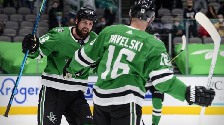 Feb 11, 2021; Dallas, Texas, USA; Dallas Stars left wing Jamie Benn (14) and center Joe Pavelski (16) celebrate Pavelski scoring a goal against the Carolina Hurricanes during the second period at the American Airlines Center. Mandatory Credit: Jerome Miron-USA TODAY Sports