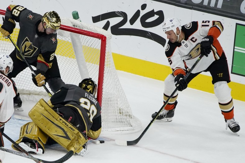 Feb 11, 2021; Las Vegas, Nevada, USA; Anaheim Ducks center Ryan Getzlaf (15) attempts a shot on Vegas Golden Knights goaltender Marc-Andre Fleury (29) during the first period at T-Mobile Arena. Mandatory Credit: John Locher/Pool Photos-USA TODAY Sports