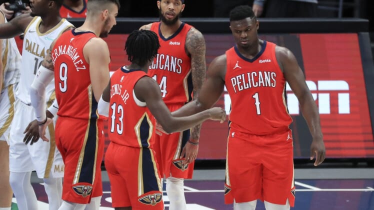 Feb 12, 2021; Dallas, Texas, USA; New Orleans Pelicans forward Zion Williamson (1) celebrates with teammates after scoring during the second quarter against the Dallas Mavericks at American Airlines Center. Mandatory Credit: Kevin Jairaj-USA TODAY Sports