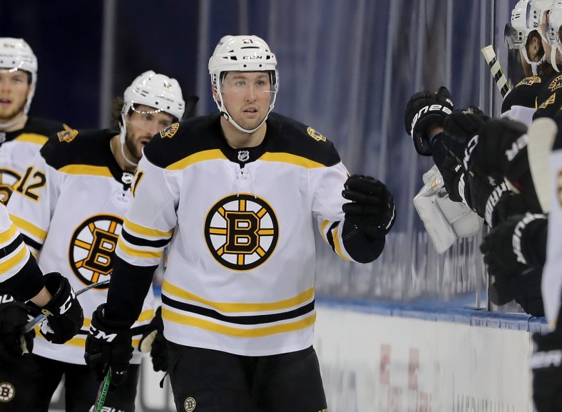 Feb 12, 2021; New York, New York, USA; Boston Bruins left wing Nick Ritchie (21) celebrates with teammates on the bench after scoring a goal against the New York Rangers in the second period at Madison Square Garden. Mandatory Credit: Elsa/Pool Photos-USA TODAY Sports