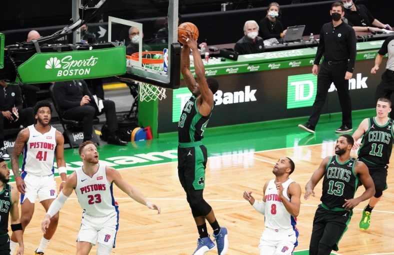 Feb 12, 2021; Boston, Massachusetts, USA; Boston Celtics guard Javonte Green (43) makes the basket against Detroit Pistons forward Blake Griffin (23) in the second quarter at TD Garden. Mandatory Credit: David Butler II-USA TODAY Sports