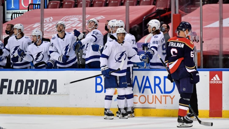 Feb 13, 2021; Sunrise, Florida, USA; Tampa Bay Lightning right wing Mathieu Joseph (7) celebrates his goal against the Florida Panthers with teammates on the bench during the second period at BB&T Center. Mandatory Credit: Jasen Vinlove-USA TODAY Sports
