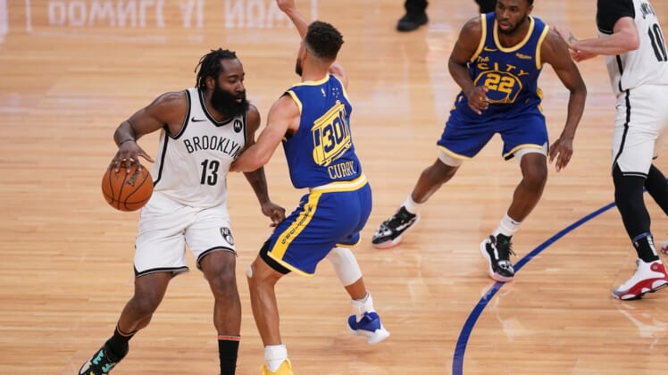 Feb 13, 2021; San Francisco, California, USA; Brooklyn Nets guard James Harden (13) dribbles against Golden State Warriors guard Stephen Curry (30) in the second quarter at the Chase Center. Mandatory Credit: Cary Edmondson-USA TODAY Sports