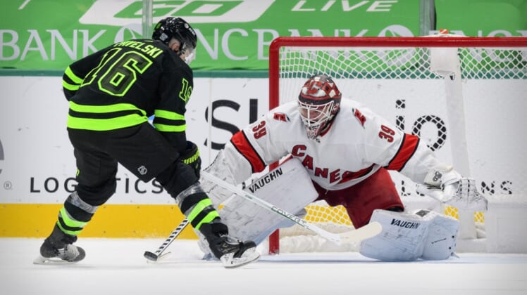 Feb 13, 2021; Dallas, Texas, USA; Carolina Hurricanes goaltender Alex Nedeljkovic (39) stops a shot by Dallas Stars center Joe Pavelski (16) during the overtime shootout at the American Airlines Center. Mandatory Credit: Jerome Miron-USA TODAY Sports