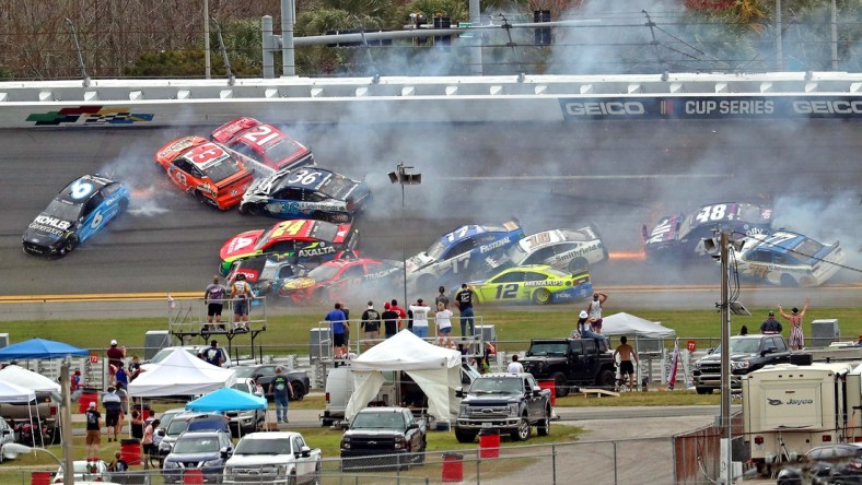 Feb 14, 2021; Daytona Beach, Florida, USA; NASCAR Cup Series drivers Ryan Newman (6), Erik Jones (43), Tyler Reddick (8), Martin Truex Jr. (19), Aric Almirola (10), Chris Buescher (17) and Alex Bowman (48) wreck during the Daytona 500 at Daytona International Speedway. Mandatory Credit: Mark J. Rebilas-USA TODAY Sports