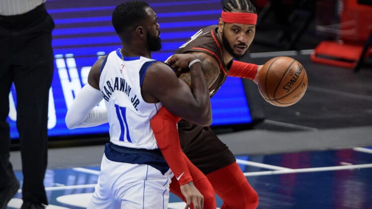 Feb 14, 2021; Dallas, Texas, USA; Dallas Mavericks forward Tim Hardaway Jr. (11) defends against Portland Trail Blazers forward Carmelo Anthony (00) during the first quarter at the American Airlines Center. Mandatory Credit: Jerome Miron-USA TODAY Sports