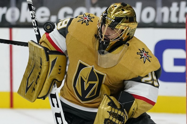 Feb 14, 2021; Las Vegas, Nevada, USA; Vegas Golden Knights goaltender Marc-Andre Fleury (29) blocks a shot by the Colorado Avalanche during the third period at T-Mobile Arena. Mandatory Credit:  John Locher/Pool Photo-USA TODAY Sports