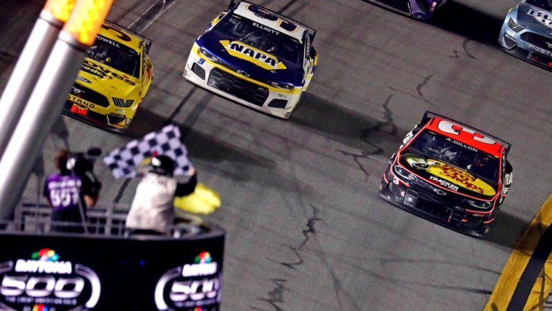 Feb 14, 2021; Daytona Beach, Florida, USA; NASCAR Cup Series driver Michael McDowell (34) leads NASCAR Cup Series driver Chase Elliot (9) to win the during the Daytona 500 at Daytona International Speedway. Mandatory Credit: Mark J. Rebilas-USA TODAY Sports