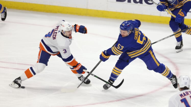Feb 15, 2021; Buffalo, New York, USA;  New York Islanders defenseman Adam Pelech (3) blocks a shot on goal by Buffalo Sabres left wing Jeff Skinner (53) during the second period at KeyBank Center. Mandatory Credit: Timothy T. Ludwig-USA TODAY Sports