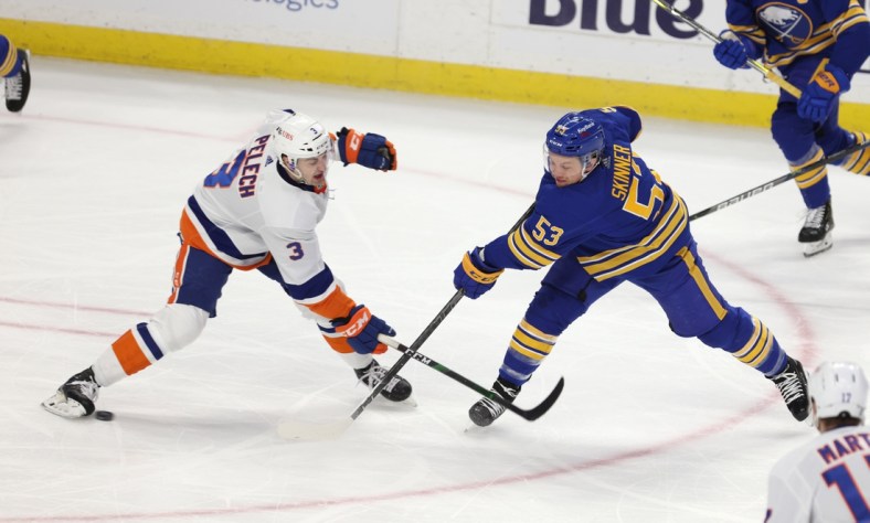 Feb 15, 2021; Buffalo, New York, USA;  New York Islanders defenseman Adam Pelech (3) blocks a shot on goal by Buffalo Sabres left wing Jeff Skinner (53) during the second period at KeyBank Center. Mandatory Credit: Timothy T. Ludwig-USA TODAY Sports
